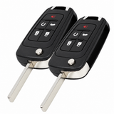 Two Buick PEPS five-button flip remote keys with uncut blades