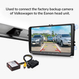 Black A501 rearview backup camera decoder box with silver housing, connected to Volkswagen VW to Eonon car stereo.