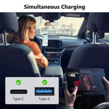 Woman in passenger seat charging her iPhone 15 with USB PD Type-C cable, shown alongside black Type-A charging adapter.