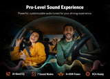 Black Double DIN 7-inch QLED wireless CarPlay Android Auto car stereo with orange wave design and three passengers in a dark car.