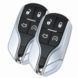 Two Maserati four-button black and silver proximity remote keys