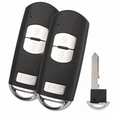 Two Mazda KDY3-67-5DY three-button smart remotes and emergency blade detail