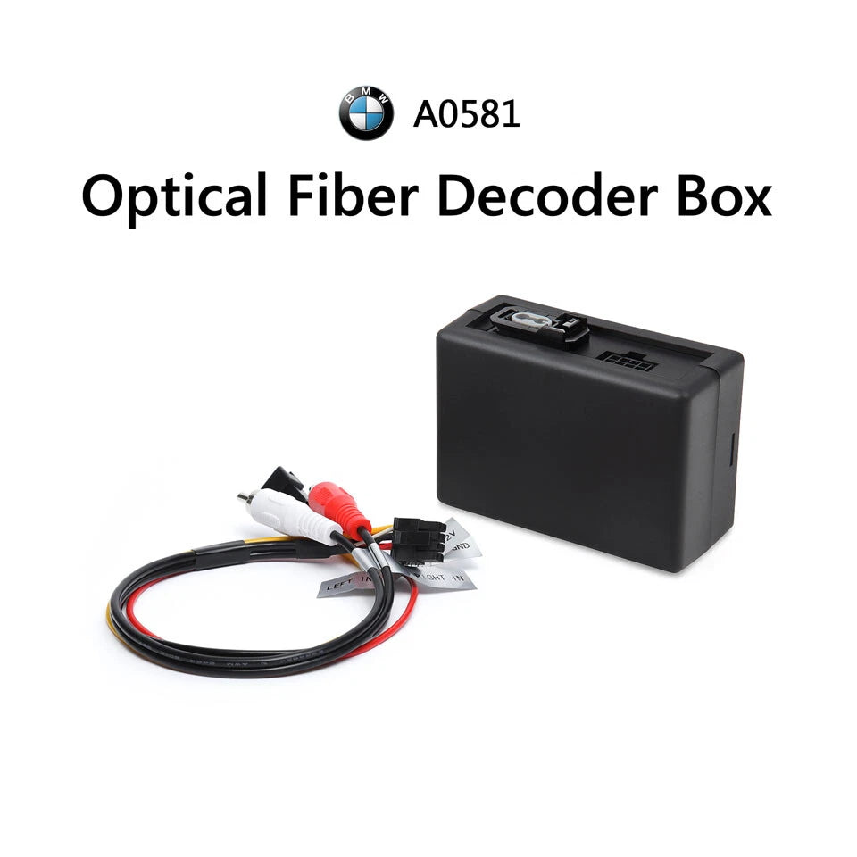 Black optical fiber decoder box with labeled input ports, surrounded by red and white BMW E90-E93 car stereo logic 7 sound system.