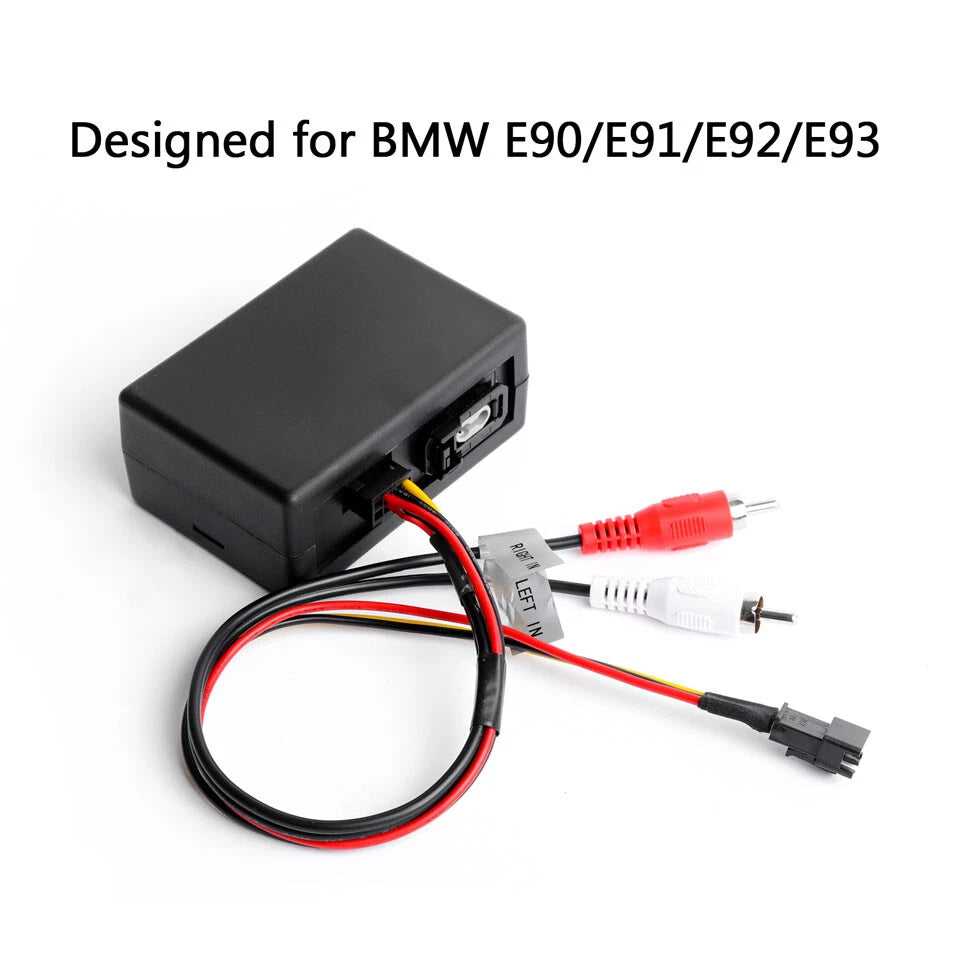 Black optical fiber decoder box with red and white label, shown with coaxial RCA cables and a black plug-in power adapter.